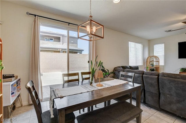 4240 Spring Storm Ave, North Las Vegas, NV 89081 - dining room featuring a chandelier and light tile patterned floors