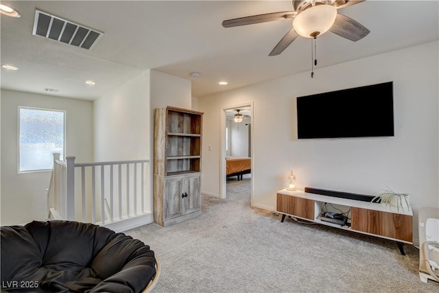 4240 Spring Storm Ave, North Las Vegas, NV 89081 - carpeted living area with a ceiling fan and recessed lighting