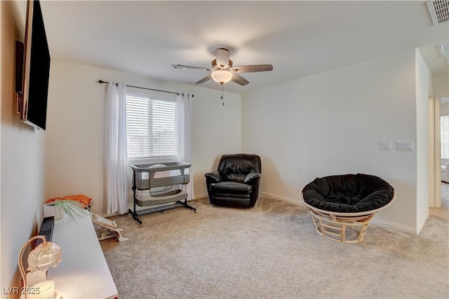 4240 Spring Storm Ave, North Las Vegas, NV 89081 - living area featuring ceiling fan and carpet floors