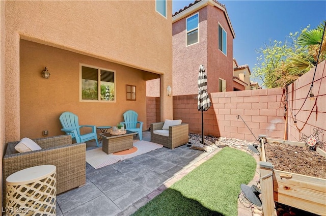 7704 Lots Hills Dr, Las Vegas, NV 89179 - fenced backyard featuring a patio area and an outdoor hangout area