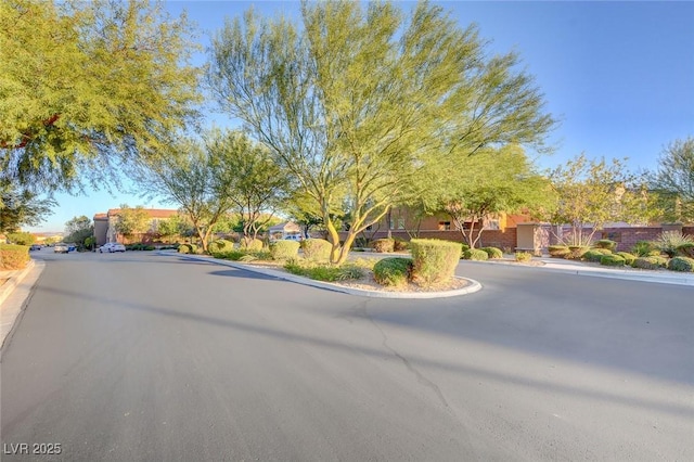 7704 Lots Hills Dr, Las Vegas, NV 89179 - view of asphalt street featuring curbs
