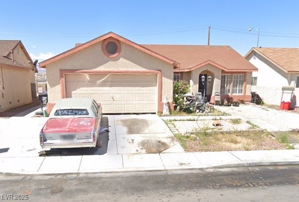 2227 Patriotic Ln, North Las Vegas, NV 89032 - ranch-style house with an attached garage, concrete driveway, and stucco siding