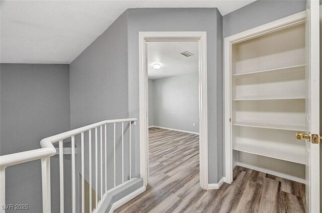 198 Winterport St, Henderson, NV 89074 - corridor featuring wood finished floors and an upstairs landing