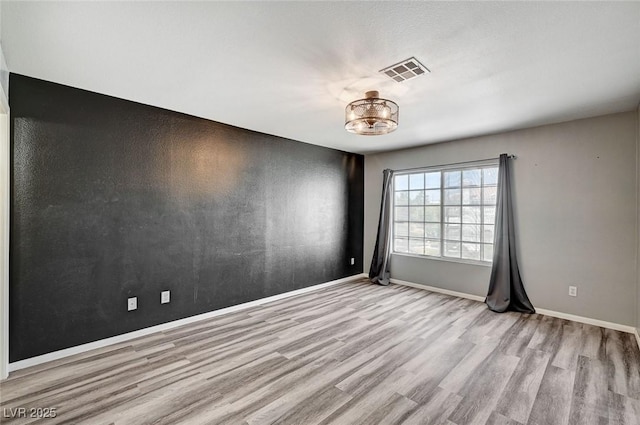 198 Winterport St, Henderson, NV 89074 - unfurnished room with wood finished floors and a chandelier