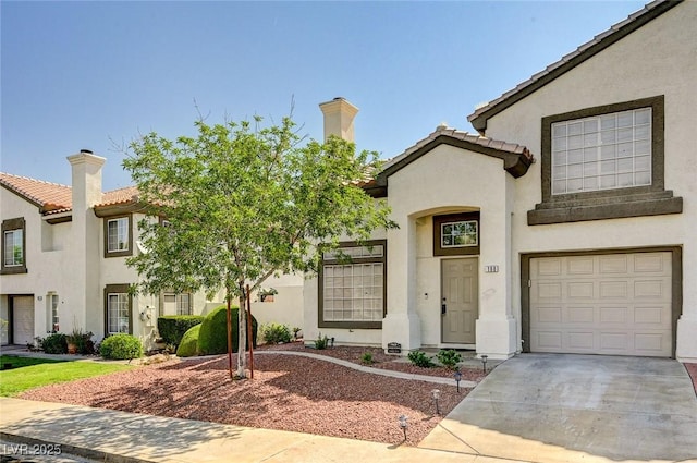 198 Winterport St, Henderson, NV 89074 - view of front of home with stucco siding, a tiled roof, and concrete driveway