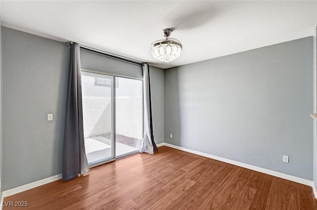 198 Winterport St, Henderson, NV 89074 - unfurnished room featuring wood finished floors and a chandelier