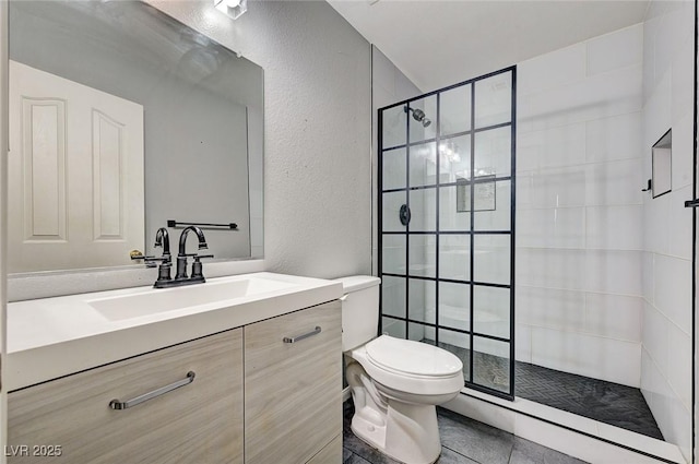 198 Winterport St, Henderson, NV 89074 - bathroom featuring a textured wall, tiled shower, and vanity