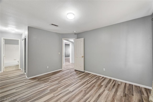 198 Winterport St, Henderson, NV 89074 - spare room with light wood-style floors and a textured ceiling