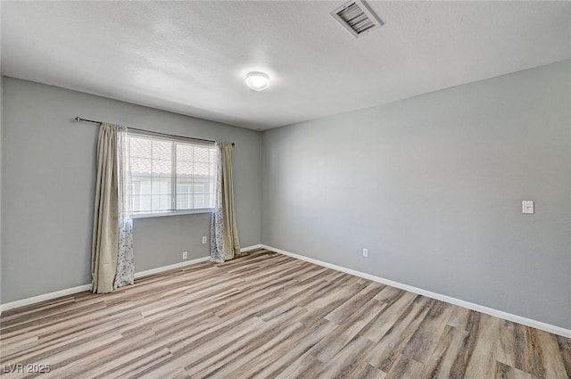198 Winterport St, Henderson, NV 89074 - unfurnished room with wood finished floors and a textured ceiling