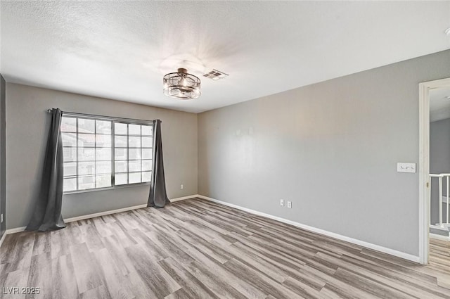 198 Winterport St, Henderson, NV 89074 - spare room with wood finished floors and a chandelier