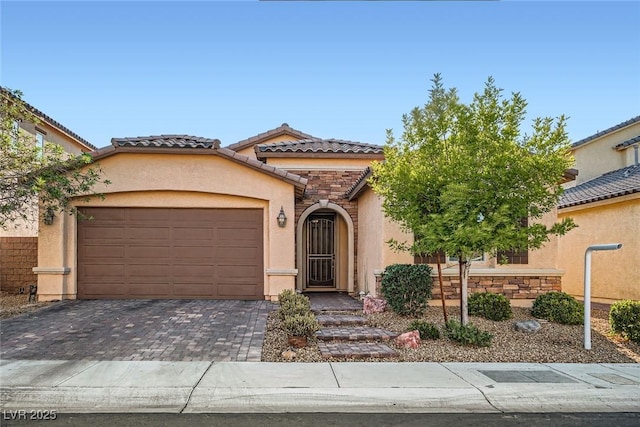 6233 Canterbury Field Rd, Las Vegas, NV 89113 - mediterranean / spanish-style home featuring stucco siding, a tile roof, a garage, and driveway