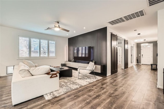 6233 Canterbury Field Rd, Las Vegas, NV 89113 - living area featuring a ceiling fan, wood finished floors, and recessed lighting