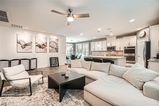6233 Canterbury Field Rd, Las Vegas, NV 89113 - living area with light wood-style flooring, recessed lighting, and ceiling fan