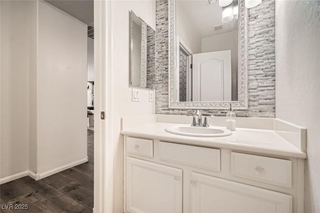 6233 Canterbury Field Rd, Las Vegas, NV 89113 - bathroom with wood finished floors and vanity