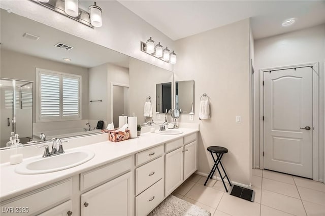 6233 Canterbury Field Rd, Las Vegas, NV 89113 - bathroom with a bath, double vanity, tile patterned flooring, and a stall shower