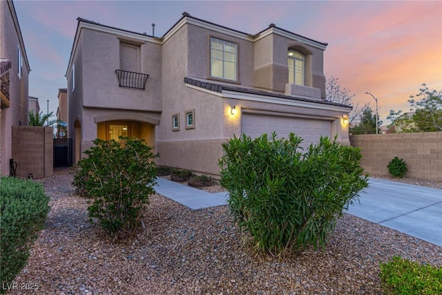 9006 Cedar Door Ave, Las Vegas, NV 89148 - view of front of home featuring a garage, stucco siding, and concrete driveway
