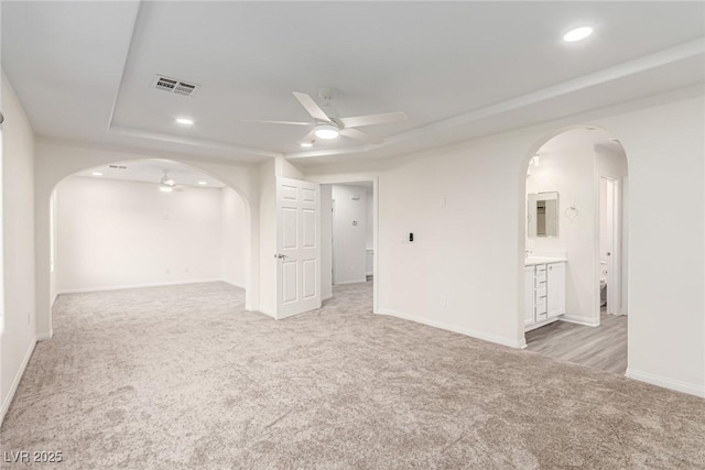 9006 Cedar Door Ave, Las Vegas, NV 89148 - empty room with a ceiling fan, arched walkways, light carpet, and recessed lighting