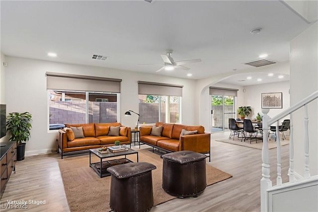 9006 Cedar Door Ave, Las Vegas, NV 89148 - living area featuring arched walkways, light wood finished floors, a ceiling fan, and recessed lighting