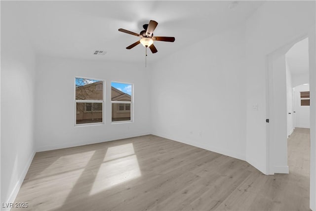 9315 Indian Corn Ct Unit 101, Las Vegas, NV 89178 - spare room featuring light wood finished floors, ceiling fan, and vaulted ceiling