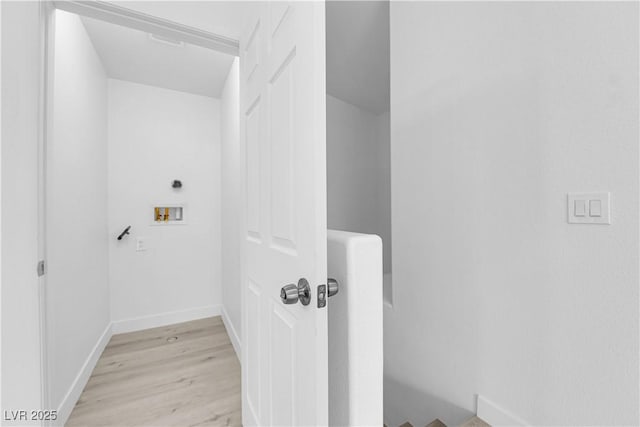 9315 Indian Corn Ct Unit 101, Las Vegas, NV 89178 - laundry room featuring washer hookup and light wood-style flooring
