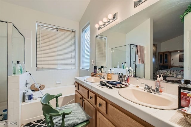 5413 Flora Spray St, Las Vegas, NV 89130 - ensuite bathroom with lofted ceiling, a bath, a shower stall, and double vanity
