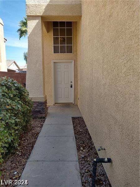 256 Camino Viejo St, Henderson, NV 89012 - doorway to property with stucco siding