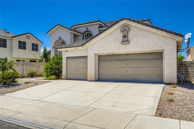 5409 Flora Spray St, Las Vegas, NV 89130 - view of front of house featuring an attached garage, stucco siding, and concrete driveway