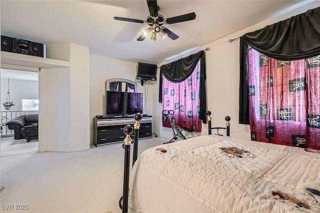 5409 Flora Spray St, Las Vegas, NV 89130 - carpeted bedroom with a ceiling fan and multiple windows