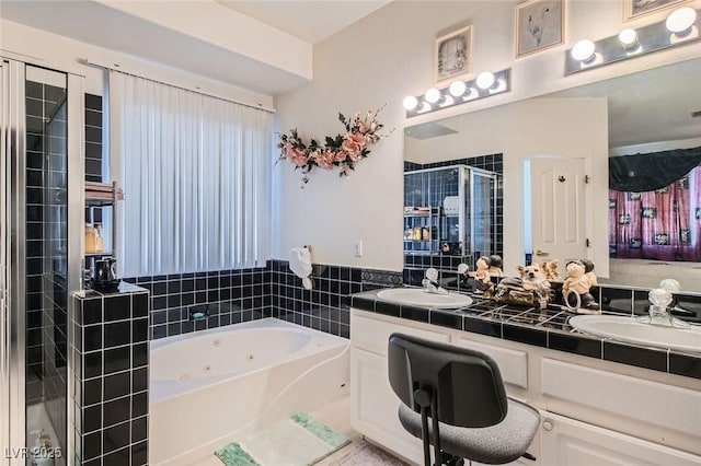 5409 Flora Spray St, Las Vegas, NV 89130 - full bathroom featuring double vanity, a tub with jets, and a stall shower