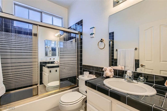 5409 Flora Spray St, Las Vegas, NV 89130 - bathroom featuring vanity and shower / bath combination with glass door