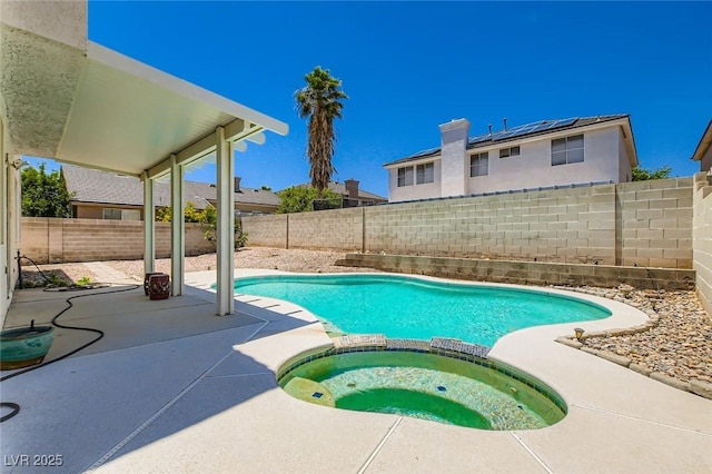 5409 Flora Spray St, Las Vegas, NV 89130 - view of pool featuring a patio area, a pool with connected hot tub, and a fenced backyard