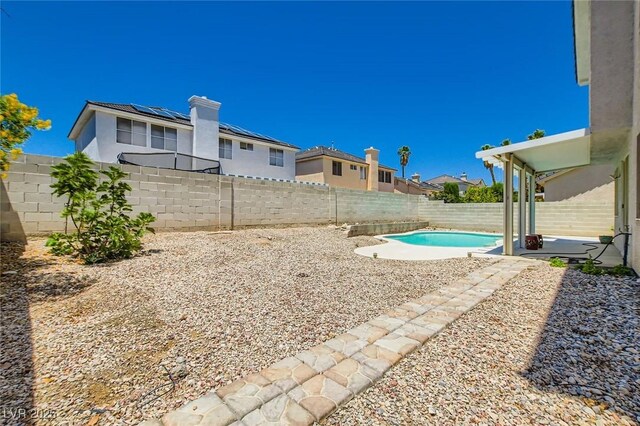 5409 Flora Spray St, Las Vegas, NV 89130 - fenced backyard with a patio area