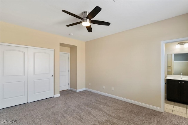 9240 Northfield Park Ct, Las Vegas, NV 89148 - unfurnished bedroom featuring light colored carpet, a closet, connected bathroom, and a ceiling fan