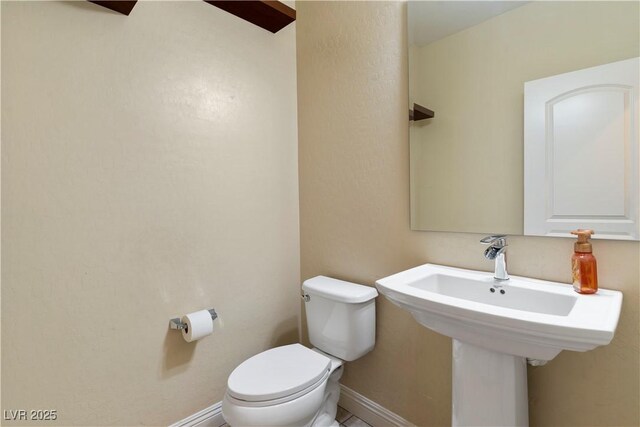9240 Northfield Park Ct, Las Vegas, NV 89148 - half bathroom with toilet and baseboards