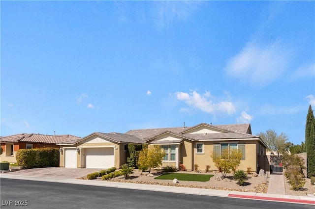 9240 Northfield Park Ct, Las Vegas, NV 89148 - ranch-style house featuring an attached garage, driveway, and stucco siding