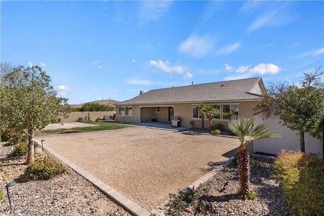 9240 Northfield Park Ct, Las Vegas, NV 89148 - rear view of house with a patio and stucco siding