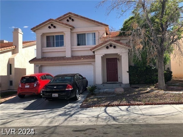 8769 Country View Ave, Las Vegas, NV 89129 - view of front facade with driveway, stucco siding, a tiled roof, and a garage