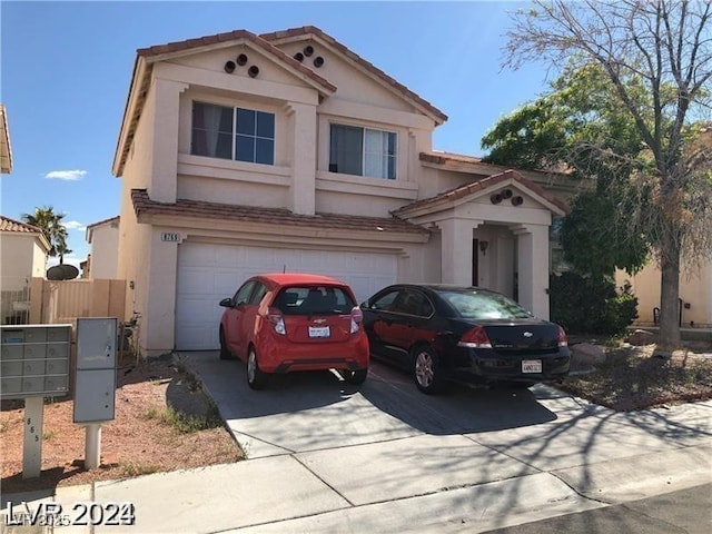 8769 Country View Ave, Las Vegas, NV 89129 - view of front of property with driveway, stucco siding, an attached garage, and a tile roof