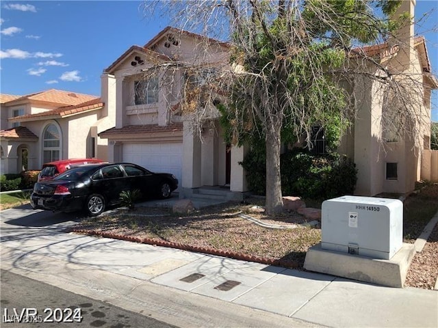 8769 Country View Ave, Las Vegas, NV 89129 - mediterranean / spanish-style home with stucco siding, concrete driveway, and a garage