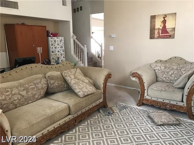 8769 Country View Ave, Las Vegas, NV 89129 - carpeted living area featuring stairs and baseboards
