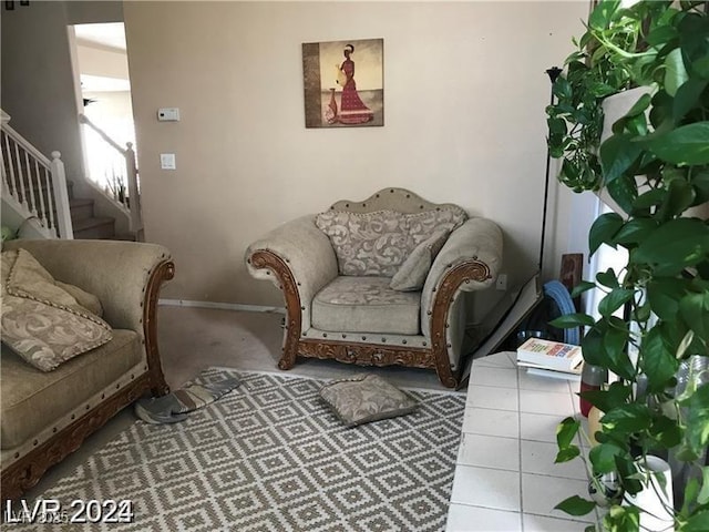8769 Country View Ave, Las Vegas, NV 89129 - carpeted living room with stairway and baseboards