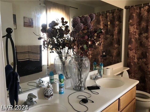 8769 Country View Ave, Las Vegas, NV 89129 - bathroom with toilet and vanity