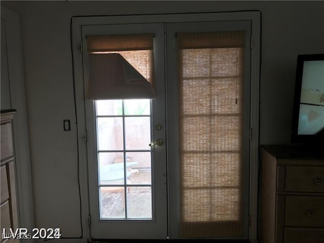 8769 Country View Ave, Las Vegas, NV 89129 - doorway to outside with french doors and healthy amount of natural light