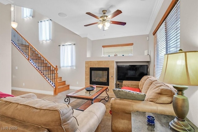 10601 Lessona St, Las Vegas, NV 89141 - living area featuring a tiled fireplace, stairway, and healthy amount of natural light