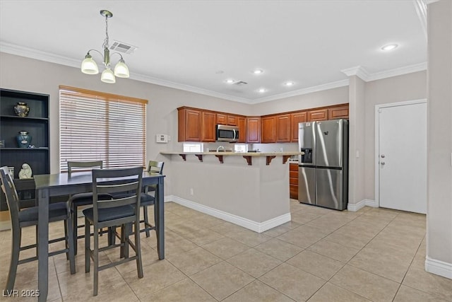10601 Lessona St, Las Vegas, NV 89141 - kitchen featuring appliances with stainless steel finishes, a peninsula, a breakfast bar area, light countertops, and light tile patterned flooring