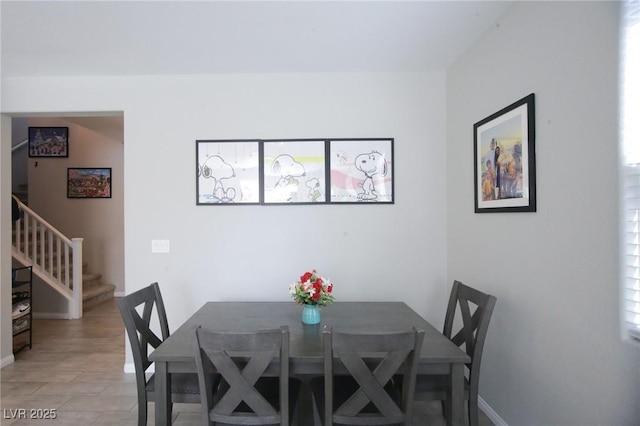 7037 Tilligerry St, North Las Vegas, NV 89084 - dining space with stairway and baseboards