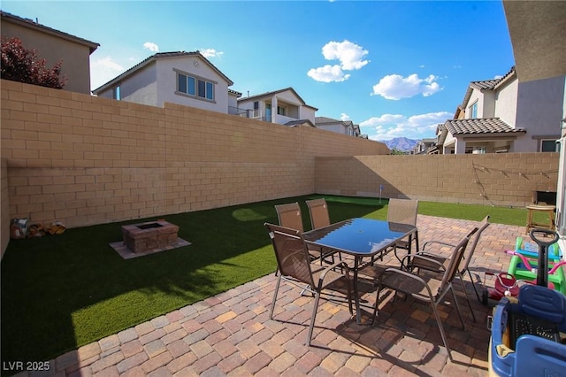 7037 Tilligerry St, North Las Vegas, NV 89084 - fenced backyard with a patio and outdoor dining space