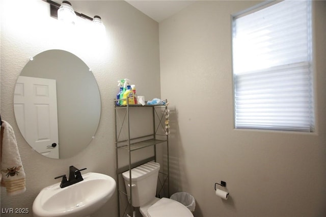 7037 Tilligerry St, North Las Vegas, NV 89084 - half bath featuring a sink and toilet