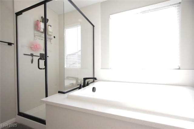 7037 Tilligerry St, North Las Vegas, NV 89084 - bathroom featuring a shower stall and a bath