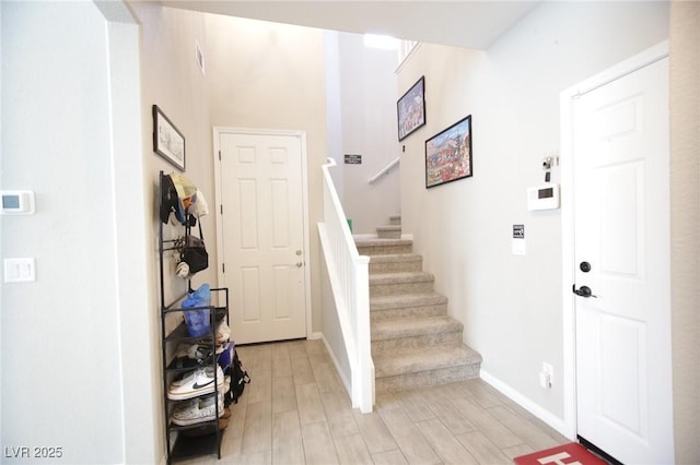7037 Tilligerry St, North Las Vegas, NV 89084 - entrance foyer featuring light wood-style flooring and stairway
